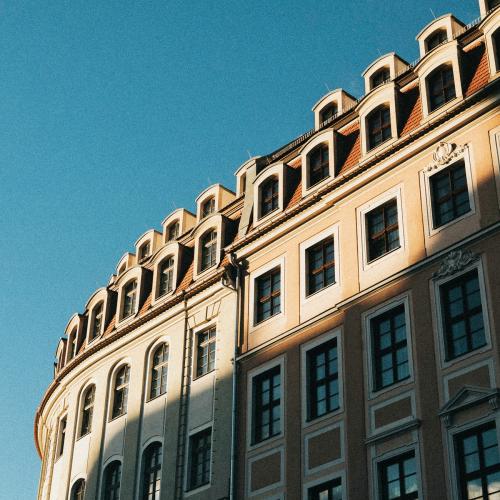 Classic European apartment building under the blue sky - 2273535