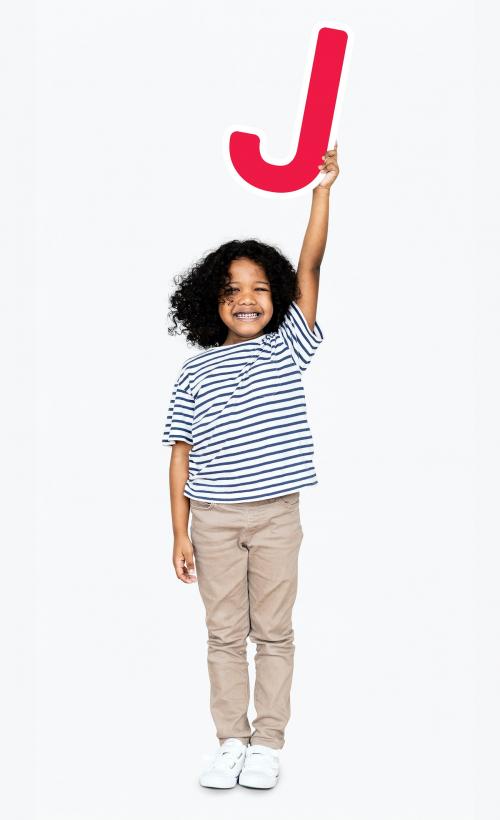 Happy boy holding the letter J - 491683