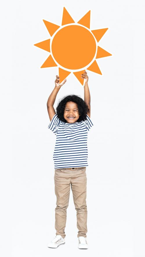 Cheerful boy holding a sun icon - 491734