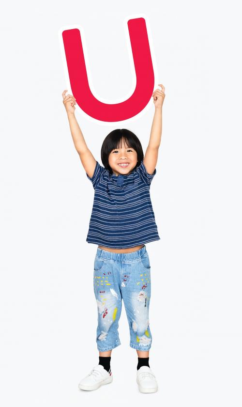 Happy boy holding the letter U - 491754