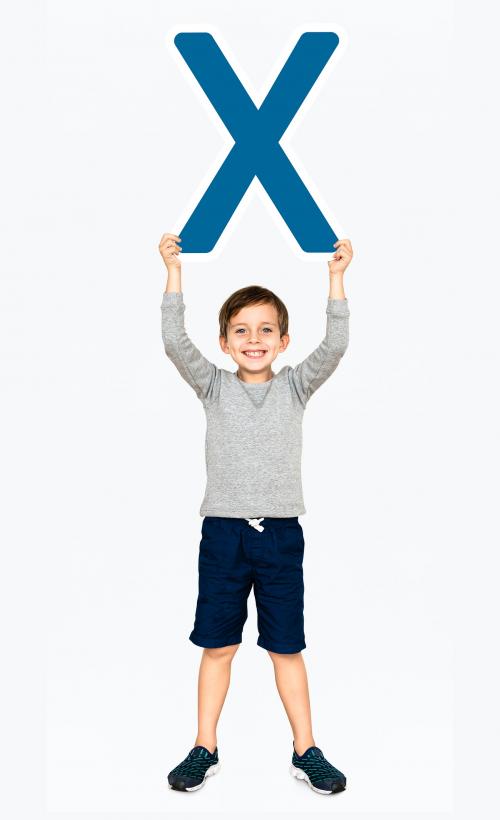 Happy boy holding the letter X - 491782