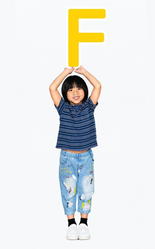 Happy boy holding the letter F - 491825