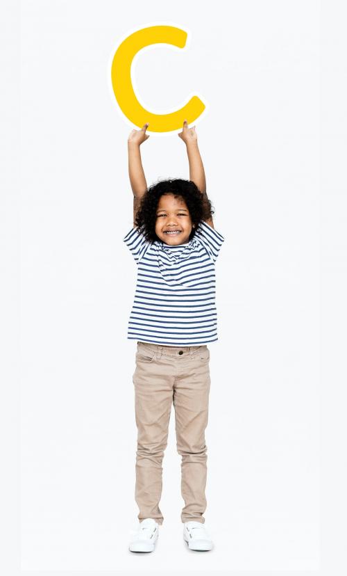 Happy boy holding the letter C - 491826