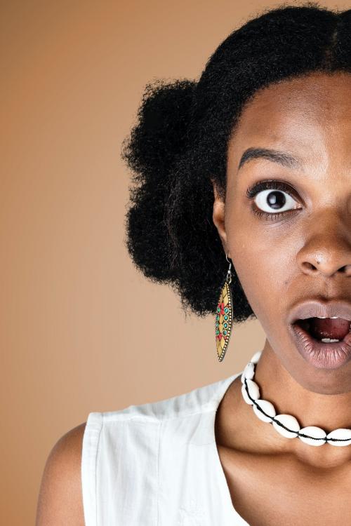 Black woman with a shocking facial expression - 2053921