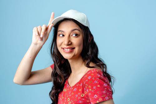 Cheerful Asian woman isolated on blue background - 2252405