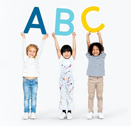 Diverse happy kids holding the ABC - 492035