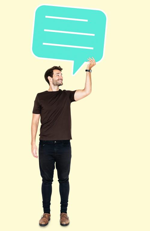 Cheerful man holding a blank speech bubble - 492136