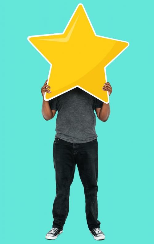 Cheerful man holding a golden star rating symbol - 492206