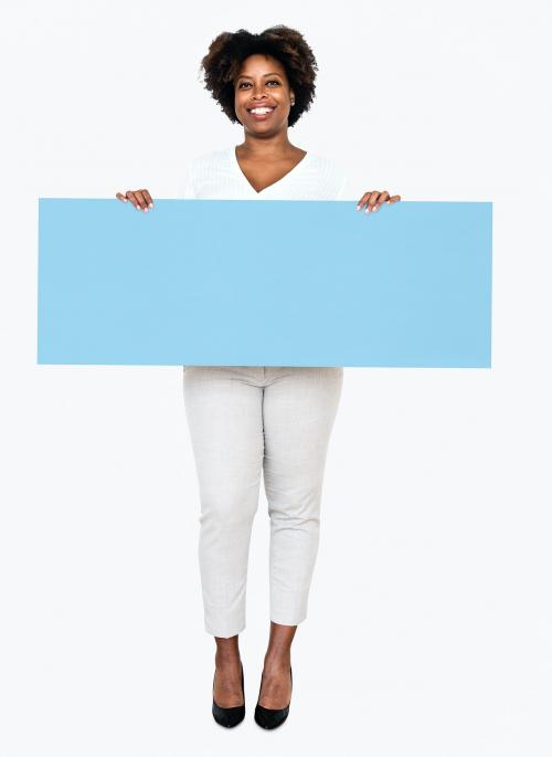 Cheerful woman showing a blank blue banner - 490951