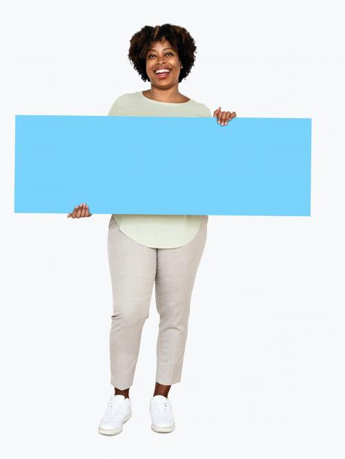 Cheerful woman showing a blank blue banner - 490953