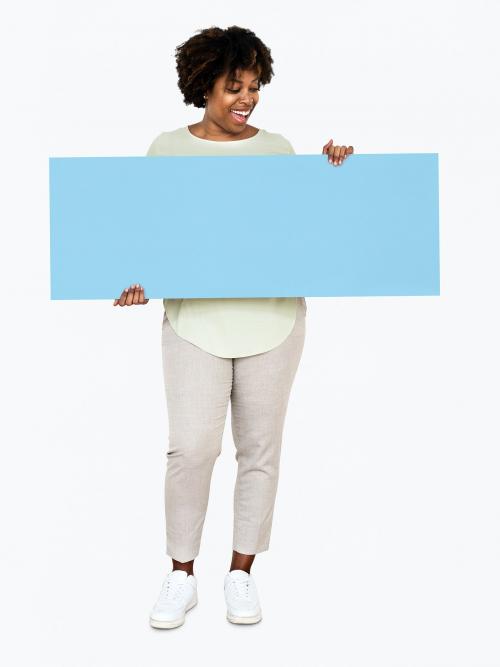 Cheerful woman showing a blank blue banner - 491041