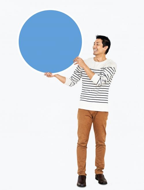 Cheerful man holding a blank blue circle - 491044