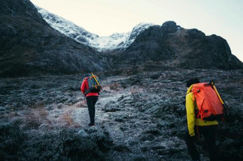 Hikers at Glen Coe valley in the Scottish Highlands - 2097843