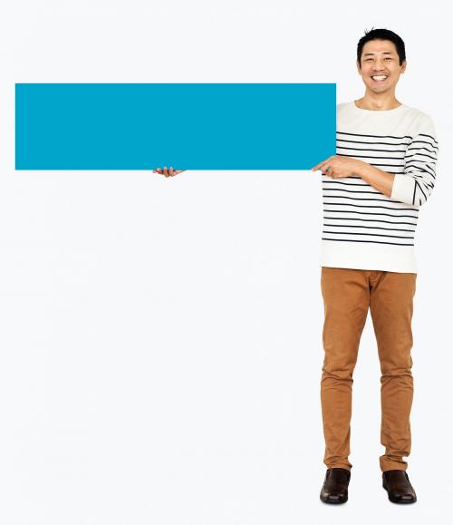 Cheerful man showing a blank blue banner - 491088