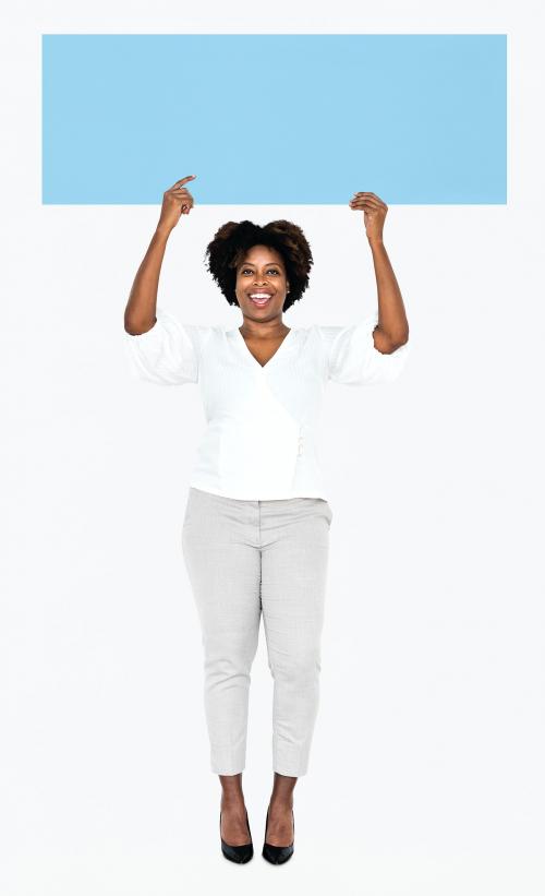 Cheerful woman showing a blank blue banner - 491154