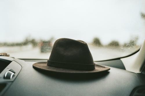 Hat on the dashboard of a car - 2268764
