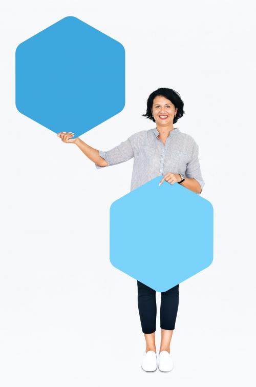 Cheerful woman showing blue hexagon shaped boards - 491214