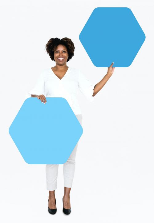 Cheerful woman showing blue hexagon shaped boards - 491234