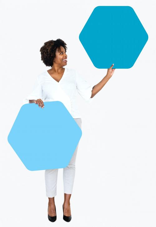 Cheerful woman showing blue hexagon shaped boards - 491254