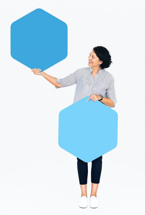 Cheerful woman showing blue hexagon shaped boards - 491275