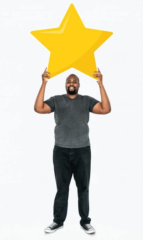 Cheerful man holding a golden star rating symbol - 477597