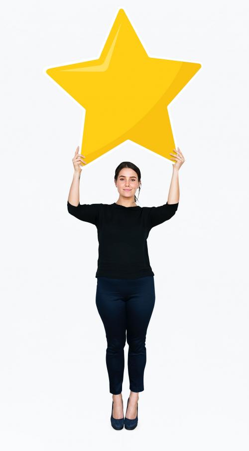 Businesswoman holding a golden star rating symbol - 477783