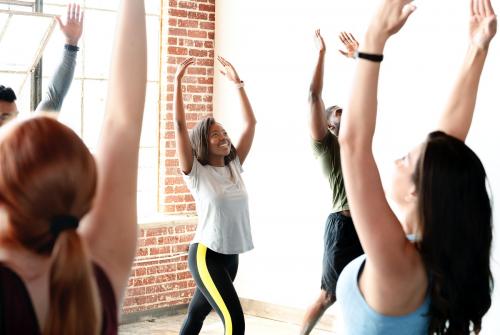 Diverse people practicing a Urdhva Hastasana pose - 2041699