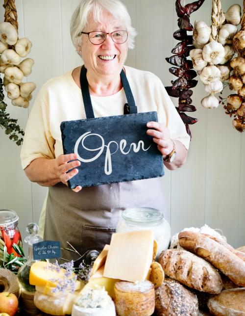 Elderly woman holding an open sign - 484652