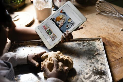 Young boy leaning to bake with his mother - 485252