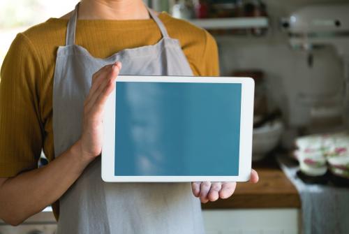 Woman holding an empty tablet - 485547