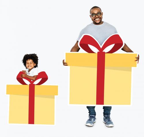 Happy father and son holding gift boxes - 490385