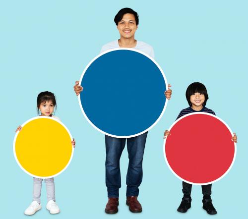 Happy family holding colorful round boards - 490407