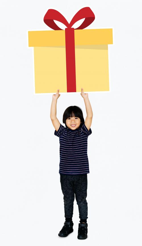 Happy boy holding a gift box - 490514