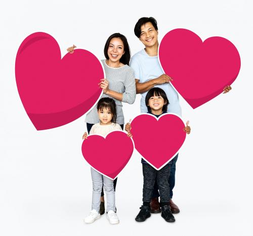 Happy family holding heart shapes - 490576