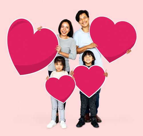 Happy family holding heart shapes - 490587