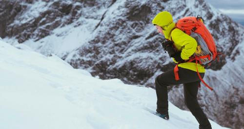 Hiker at a snowy Ben Nevis in winter - 2098300