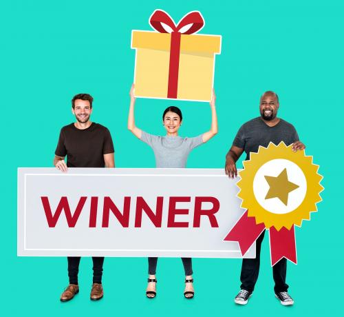 Cheerful people holding gifts and a text winner - 477497