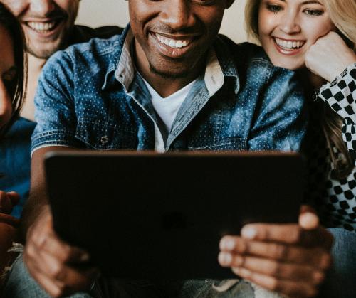 Diverse people using a digital tablet together - 2206334