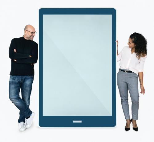 Cheerful people standing beside a tablet - 475518