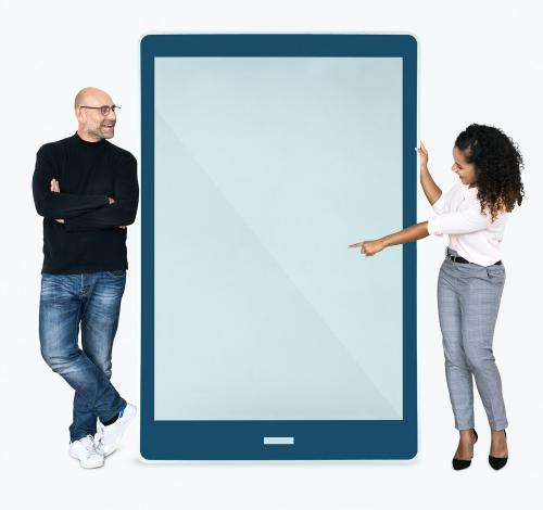 Cheerful people pointing at a tablet screen - 475536