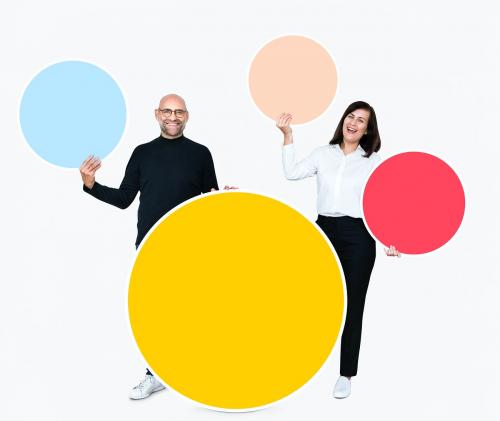 Happy people holding colorful round boards - 475544