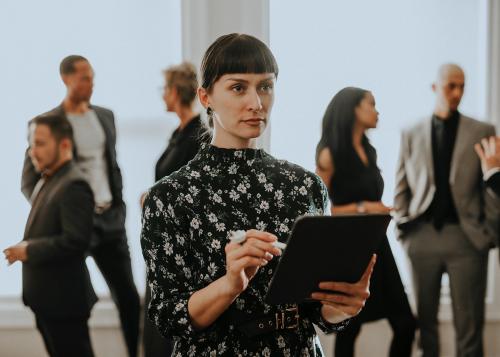 Empowering businesswoman using a digital tablet - 1216742