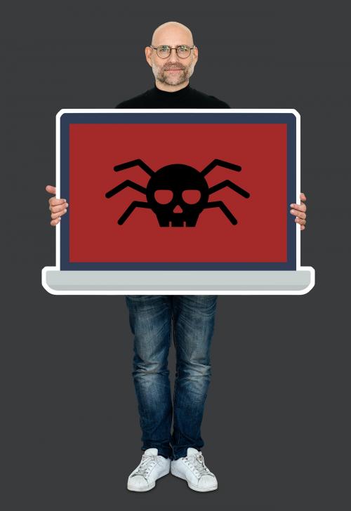 Man holding a laptop screen with a computer virus - 475568