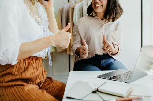 Young female designer in a boutique - 1220804