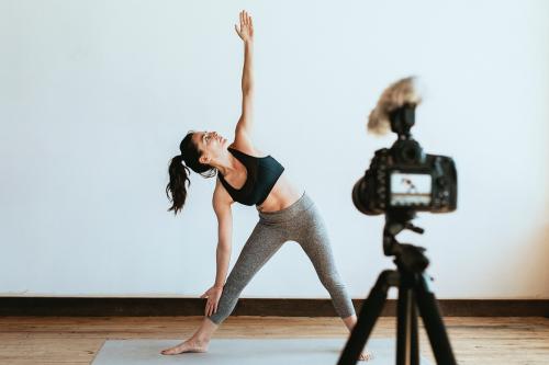 Yoga blogger recording a video - 1225689