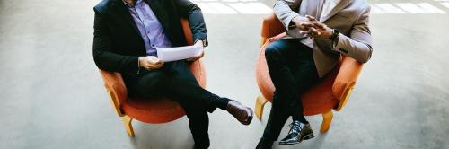 Businessmen talking and sitting on chairs social banner - 1226749