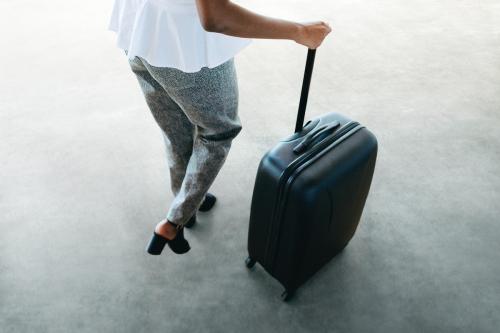 Woman and her luggage getting ready for a trip - 1226816