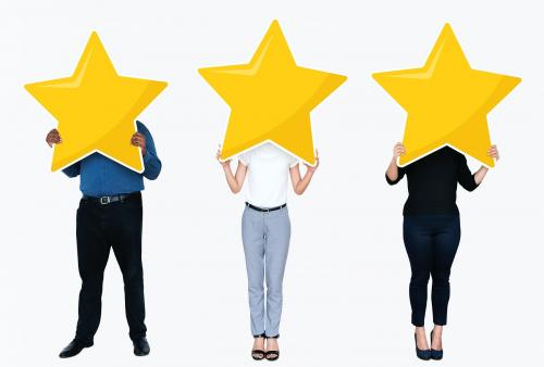 Diverse businesspeople showing a golden star rating symbol - 477305