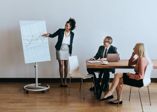 Businesswoman presenting report in a meeting - 1217954