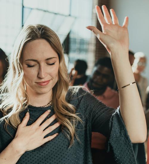 White woman raising her hand - 1223847